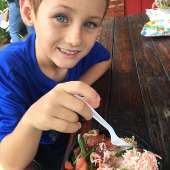 Poke Market - Isaiah enjoying his bowl. - Poke Near Me - Hilo, Hawaii Poke Market - Isaiah enjoying his bowl. - Poke Near Me - Hilo, Hawaii