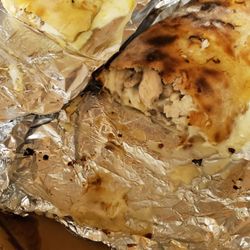 Angela's Pizza - Cut both gluten free sausage stromboli and chicken, mushroom stromboli in half.