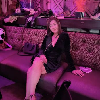 Flyway At Fox - a woman sitting on a couch - Cocktail Bars Near Me - Pomona, California