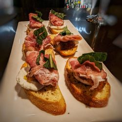 Poured - Wine, Beer & Bubbly - Goat cheese and prosciutto crostini