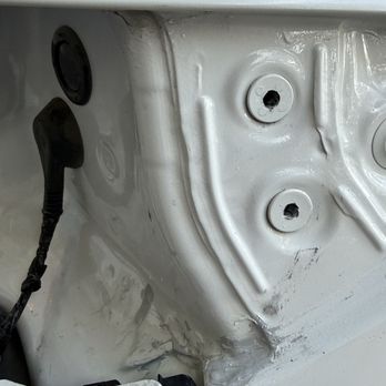 Texas Custom Body & Paint - Another view of the sealant glue they used to give the tail light a bit of a lift and the damaged tail lamp grommets - Body Shops Near Me - El Paso, Texas