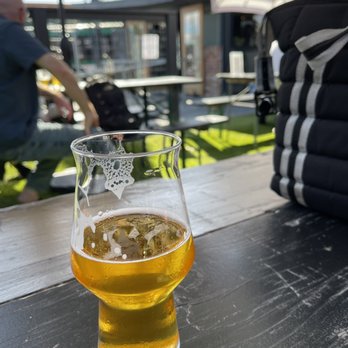 Ghost Town Brewing - Laurel - A West Coast IPA being enjoyed in the seating area. - Breweries Near Me - Oakland, California Ghost Town Brewing - Laurel - A West Coast IPA being enjoyed in the seating area. - Breweries Near Me - Oakland, California