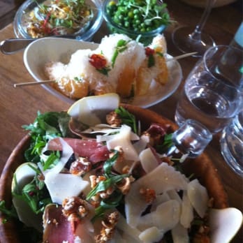 Rustic Stone - Mighty mustard salad with unreal side orders of pea, broad bean and spring onion relish, pesto chips and cauliflower florets! - New American Near Me - Dublin, D