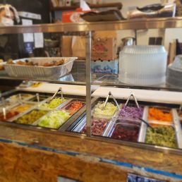 a variety of food in a buffet