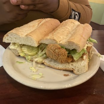 Tibby's New Orleans Kitchen - Half and half po' boy. One half shrimp and the other catfish . - Cajun/Creole Near Me - Brandon, Florida Tibby's New Orleans Kitchen - Half and half po' boy. One half shrimp and the other catfish . - Cajun/Creole Near Me - Brandon, Florida