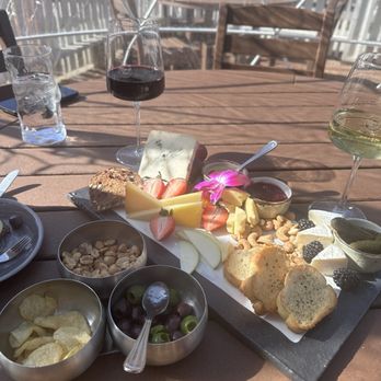 Wine & Rind - Olive, pickle and chips appetizer with the French lunch board and wine. - Wine Bars Near Me - Carmel, Indiana