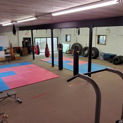 Yi's Karate Insitute - Basement level training ground with fitness equipment
