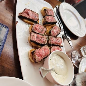 The Capital Grille - Steak slices over toast - Steakhouses Near Me - New York, New York The Capital Grille - Steak slices over toast - Steakhouses Near Me - New York, New York