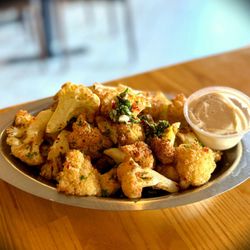 The Diplomat Eatery and Tavern - Their fried cauliflower app is fantastic- nicely seasoned with minimal breading - highly recommend!