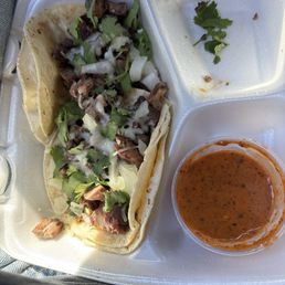 Carne asada tacos with cheese added Carne asada tacos with cheese added
