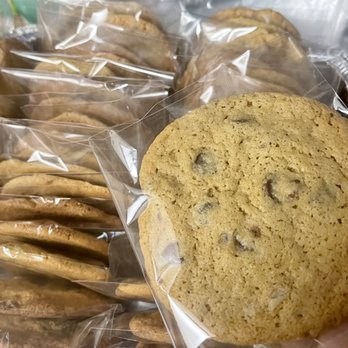 Bee Sweets Macarons - hand holding a cookie - Desserts Near Me Bee Sweets Macarons - hand holding a cookie - Desserts Near Me