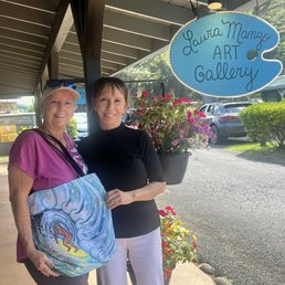 Front of Laura Mango Gallery & awesome new bags with her art work on them Front of Laura Mango Gallery & awesome new bags with her art work on them