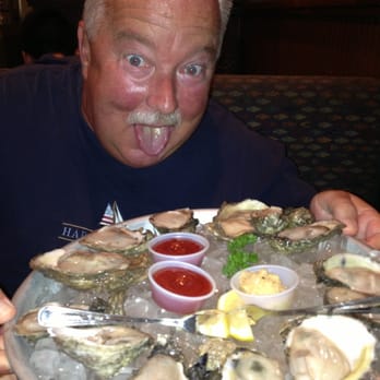 Half Shells Seafood Grill - Dad eating the delicious oysters :) - Seafood Near Me - Plano, Texas Half Shells Seafood Grill - Dad eating the delicious oysters :) - Seafood Near Me - Plano, Texas