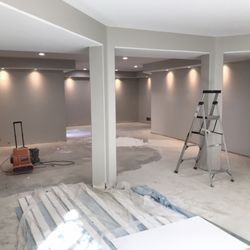 BLS Collective - Painted this basement with Repose Grey and White ceilings and trim will be going in as white and white knotty alder doors.