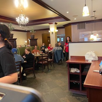Mythos - a restaurant with people sitting at tables - Greek Near Me - Buffalo, New York