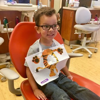 Elena Rumack, DDS MS - Cleaning them teeth - Pediatric Dentists Near Me - Calabasas, California