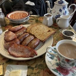 The bangers, bacon, and beans plate, with multigrain toast, double portion of the meats, and a pot of blackcurrant tea. The bangers, bacon, and beans plate, with multigrain toast, double portion of the meats, and a pot of blackcurrant tea.