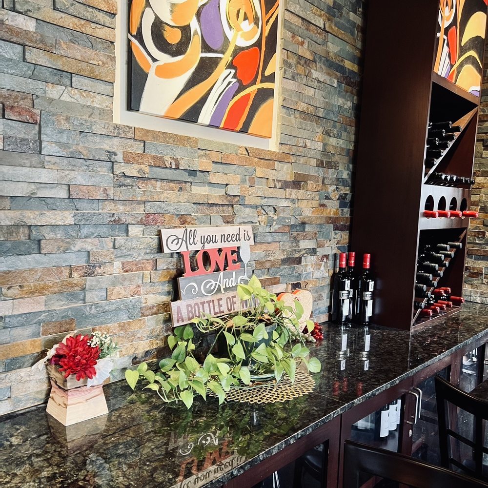 Prosecco Cafe - a wine bar with wine bottles on the counter - Breakfast & Brunch Near Me - Palm Beach Gardens, Florida Prosecco Cafe - a wine bar with wine bottles on the counter - Breakfast & Brunch Near Me - Palm Beach Gardens, Florida