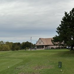 Green Meadows Golf Course & Pro Shop - Clubhouse and 1 of 2 practice greens