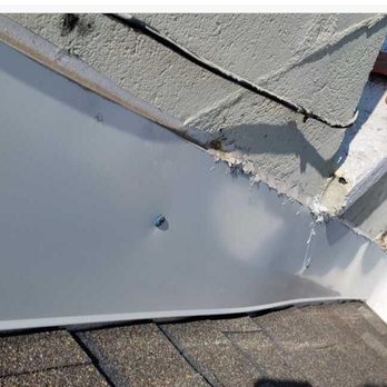 Solid Roofing - flashing with wrong hardware, missing screws and not installed correctly - Roofing Near Me - Freeport, Florida