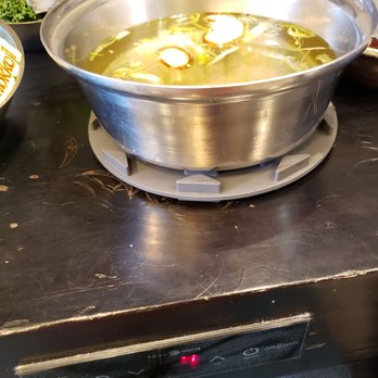 Mokkoji Shabu Shabu - Gray pads - don't move them! 7 power setting to get to boiling. Once boiling, bring down to 5. - Hot Pot Near Me - Riverside, California