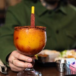 Mama Gordita's Kitchen - Mangonada Margarita! A refreshing mango slushie with a margarita mix and reposado Tequila. Chamoy and miguelito on the rim!