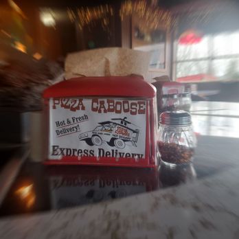 Pizza Caboose - Table around the fireplace. - Pizza Near Me - Tigard, Oregon