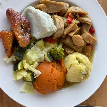 Petite Pump Room - Tasty Buttered Conch..potato stuffing..veggie medley..fungi..sweet potato & plantains - Caribbean Near Me - St. Thomas, Virgin Islands Petite Pump Room - Tasty Buttered Conch..potato stuffing..veggie medley..fungi..sweet potato & plantains - Caribbean Near Me - St. Thomas, Virgin Islands