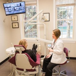 Caitlin S Hulver, DDS - Metropolitan Dental Centre - Dr. Hulver with a patient