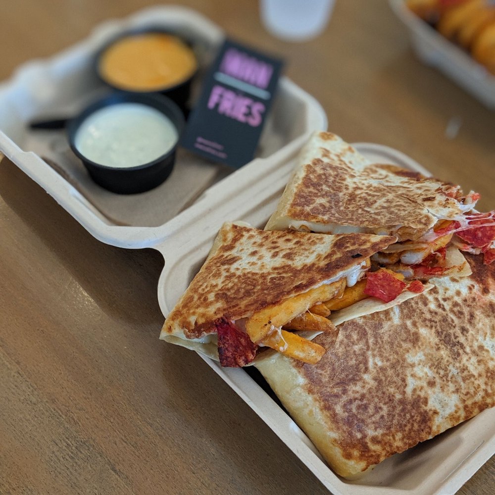Man vs Fries - HELLADILLA with cheese, fries, and flammin' hot Doritos. Sides: spiked ranch and queso. - Mexican Near Me - Livermore, California Man vs Fries - HELLADILLA with cheese, fries, and flammin' hot Doritos. Sides: spiked ranch and queso. - Mexican Near Me - Livermore, California