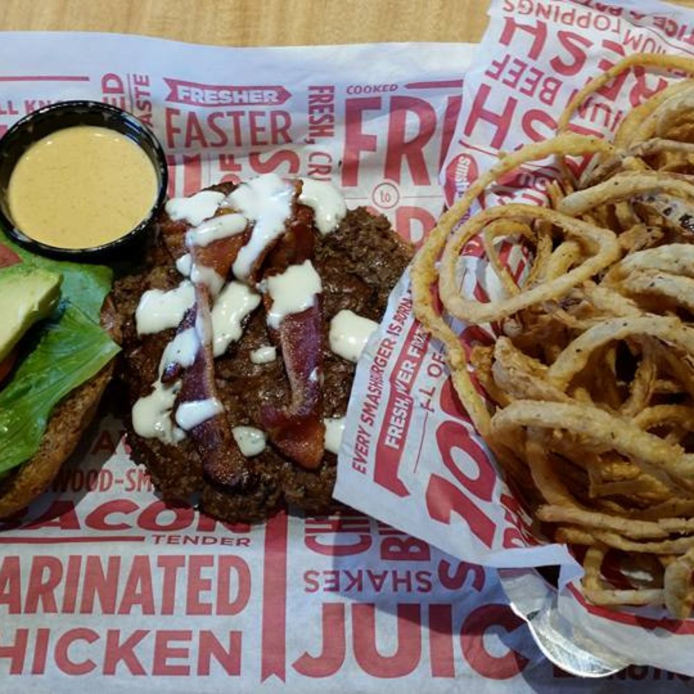 Smashburger - Avocado Club burger (7oz Angus beef, Applewood smoked bacon, avocado, lettuce, tomato, ranch dressing on multigrain roll) & Haystack onions - Burgers Near Me - Bronx, New York Smashburger - Avocado Club burger (7oz Angus beef, Applewood smoked bacon, avocado, lettuce, tomato, ranch dressing on multigrain roll) & Haystack onions - Burgers Near Me - Bronx, New York