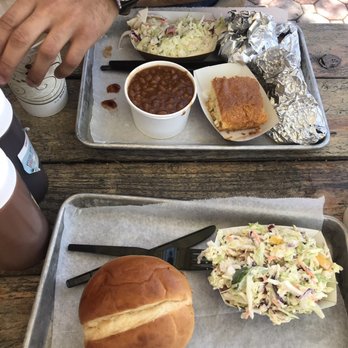 Pork Barrel BBQ - Pulled pork sandwich, coleslaw, baked beans, cornbread, and pulled pork and brisket (in the foils) - Barbeque Near Me - Alexandria, Virginia Pork Barrel BBQ - Pulled pork sandwich, coleslaw, baked beans, cornbread, and pulled pork and brisket (in the foils) - Barbeque Near Me - Alexandria, Virginia