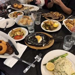 Steak, Salmon Oscar, fried calamari and shrimp combo, lamb chops and saganaki. Steak, Salmon Oscar, fried calamari and shrimp combo, lamb chops and saganaki.