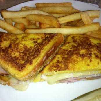 Alexanders Restaurant & Pancake House - Monte Christo sandwich with a half pickle and French fries. The bread was too thin and minimal cheese provided no flavor. - Breakfast & Brunch Near Me - Stickney, Illinois