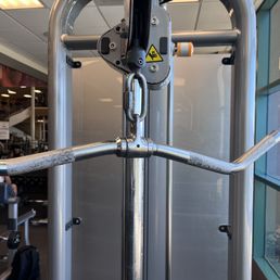 Cable machine locked so you can't interchange equipment bars