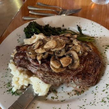 Side Door Cafe - Charbroiled 14oz Choice Rib Eye Steak Medium-Well - New American Near Me - Gleneden Beach, Oregon Side Door Cafe - Charbroiled 14oz Choice Rib Eye Steak Medium-Well - New American Near Me - Gleneden Beach, Oregon