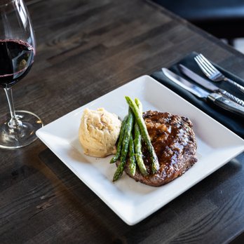 Dale's Restaurant - a steak with asparagus and a glass of wine - American Near Me - Deadwood, South Dakota