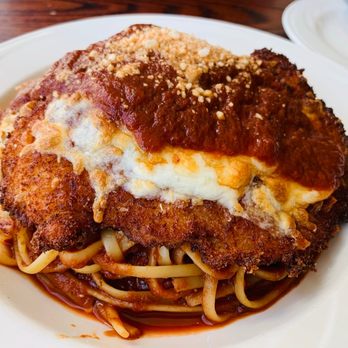 Salute - Chicken Parmesan over linguine - Italian Near Me - Hartford, Connecticut Salute - Chicken Parmesan over linguine - Italian Near Me - Hartford, Connecticut