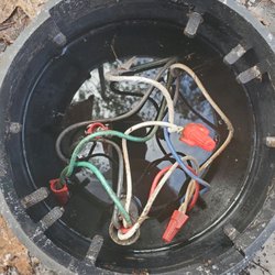 Thompson Electric & Air - Owner Fred says you need to be an electrical engineer to understand this is good work...rain and exposed wire.