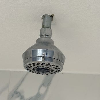 Surf City Inn - Shower head poked through shower ceiling - Hotels Near Me - Huntington Beach, California