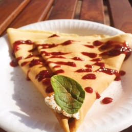 Savory crepe with ham, cream cheese, spinach and chipotle raspberry sauce on top. Savory crepe with ham, cream cheese, spinach and chipotle raspberry sauce on top.