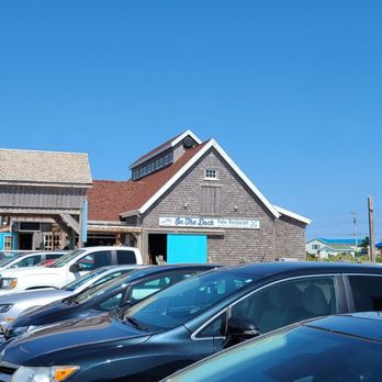 On The Dock Eatery - a row of parked cars - Seafood Near Me - Rustico, Prince Edward Island On The Dock Eatery - a row of parked cars - Seafood Near Me - Rustico, Prince Edward Island