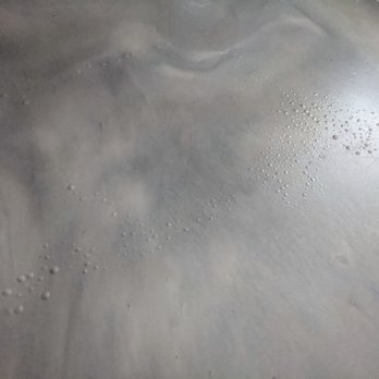Buss Custom Concrete - Epoxy coating, metallic matte with excessive blistering/bubbles due to incorrect prep of the concrete - Flooring Near Me - Hometown, Illinois