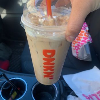 Dunkin' -  a person holding a drink in their hand - Donuts Near Me - Middletown, New York