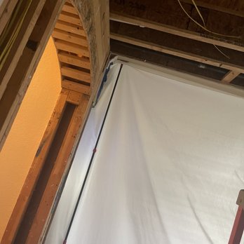 American Water Restoration - mitigation department contained area to keep dust particles, humidifier and fans in a contained area. - Damage Restoration Near Me