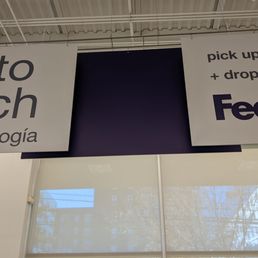 a photo of a fedex sign hanging from the ceiling a photo of a fedex sign hanging from the ceiling