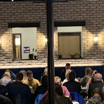 Brick - a group of people sitting at tables in a restaurant - Pizza Near Me - Steamboat Springs, Colorado Brick - a group of people sitting at tables in a restaurant - Pizza Near Me - Steamboat Springs, Colorado