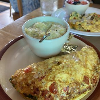 Three Little Birds - Avocado omlet with a side of grits - Breakfast & Brunch Near Me - Charleston, South Carolina Three Little Birds - Avocado omlet with a side of grits - Breakfast & Brunch Near Me - Charleston, South Carolina