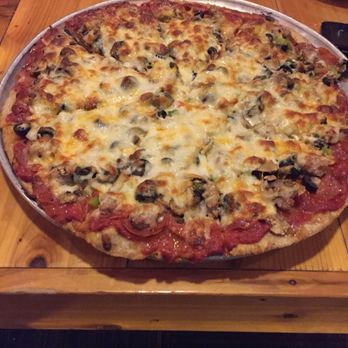 The Great Plains Sauce & Dough - Thin meat lovers - Pizza Near Me - Ames, Iowa The Great Plains Sauce & Dough - Thin meat lovers - Pizza Near Me - Ames, Iowa