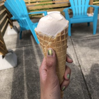 Blue Spruce Ice Cream - a hand holding an ice cream cone - Ice Cream & Frozen Yogurt Near Me - Courtenay, British Columbia Blue Spruce Ice Cream - a hand holding an ice cream cone - Ice Cream & Frozen Yogurt Near Me - Courtenay, British Columbia